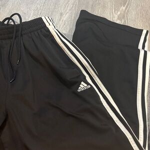 Adidas women’s Black sweatpants with White Stripes